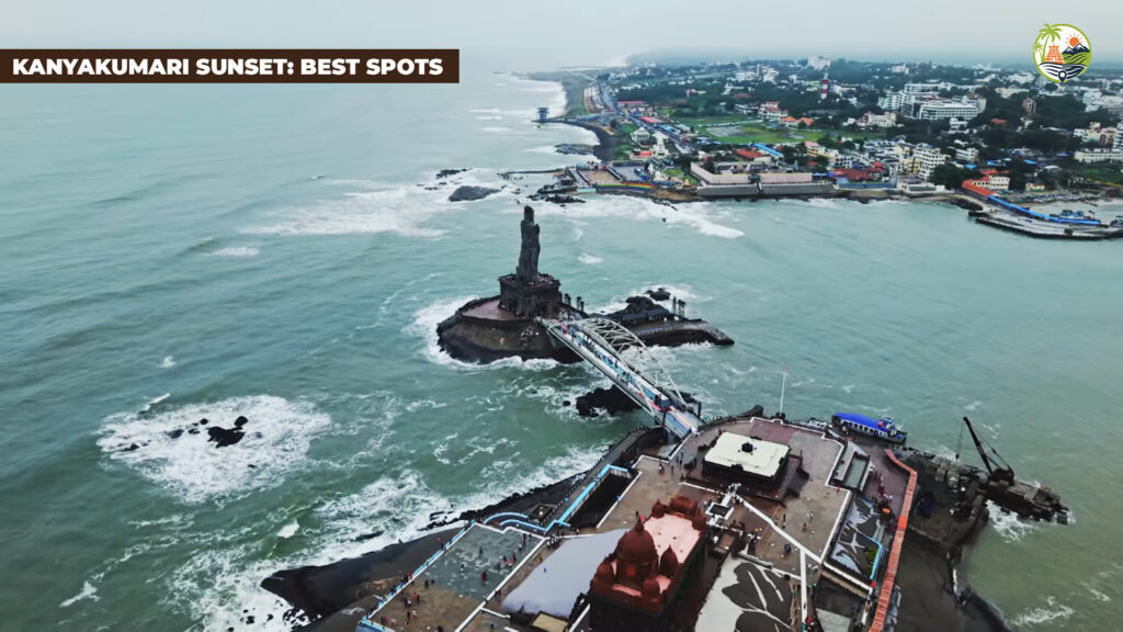 Sunset over the Arabian Sea at Kanyakumari with orange skies and people lining the west seawall near Sunset View Point.